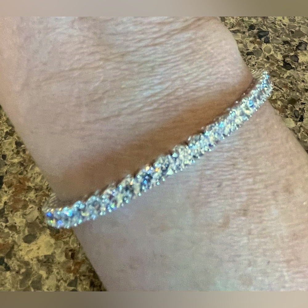 Diamonique flexible bracelet in sterling silver.  Round cubic zirconia prong set